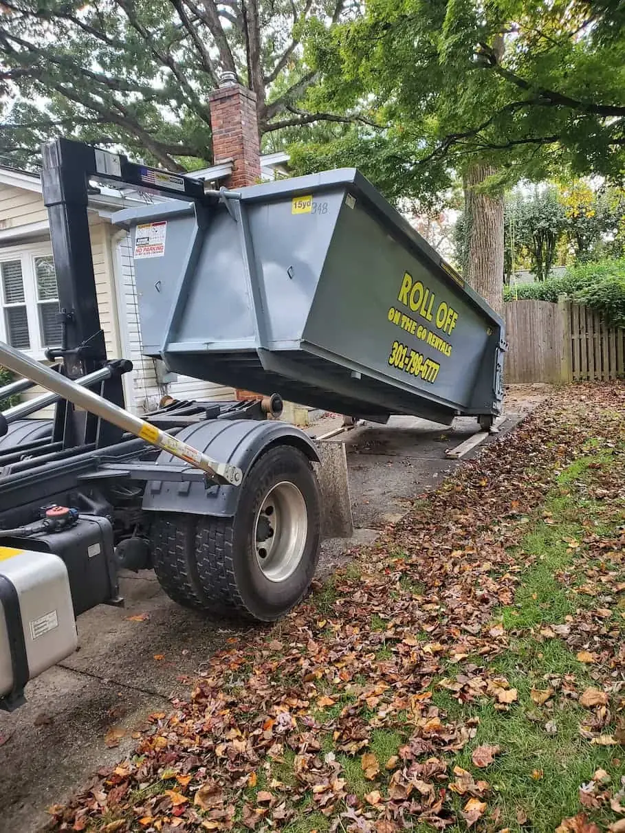 Roll Off On The Go container being delivered at a residential property